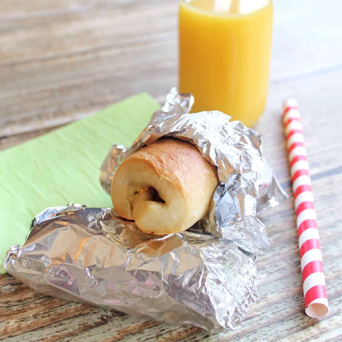 Kolaches wrapped in aluminum foil for an on the go breakfast.