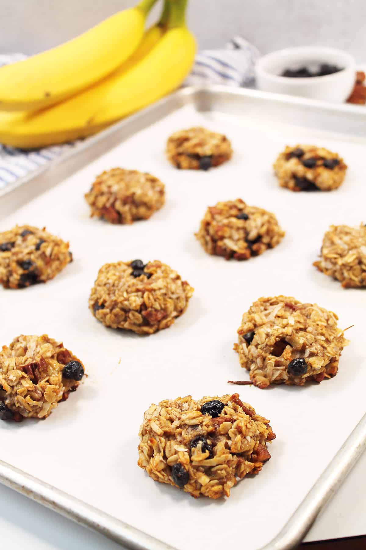 Baked oatmeal breakfast cookies on baking sheet.