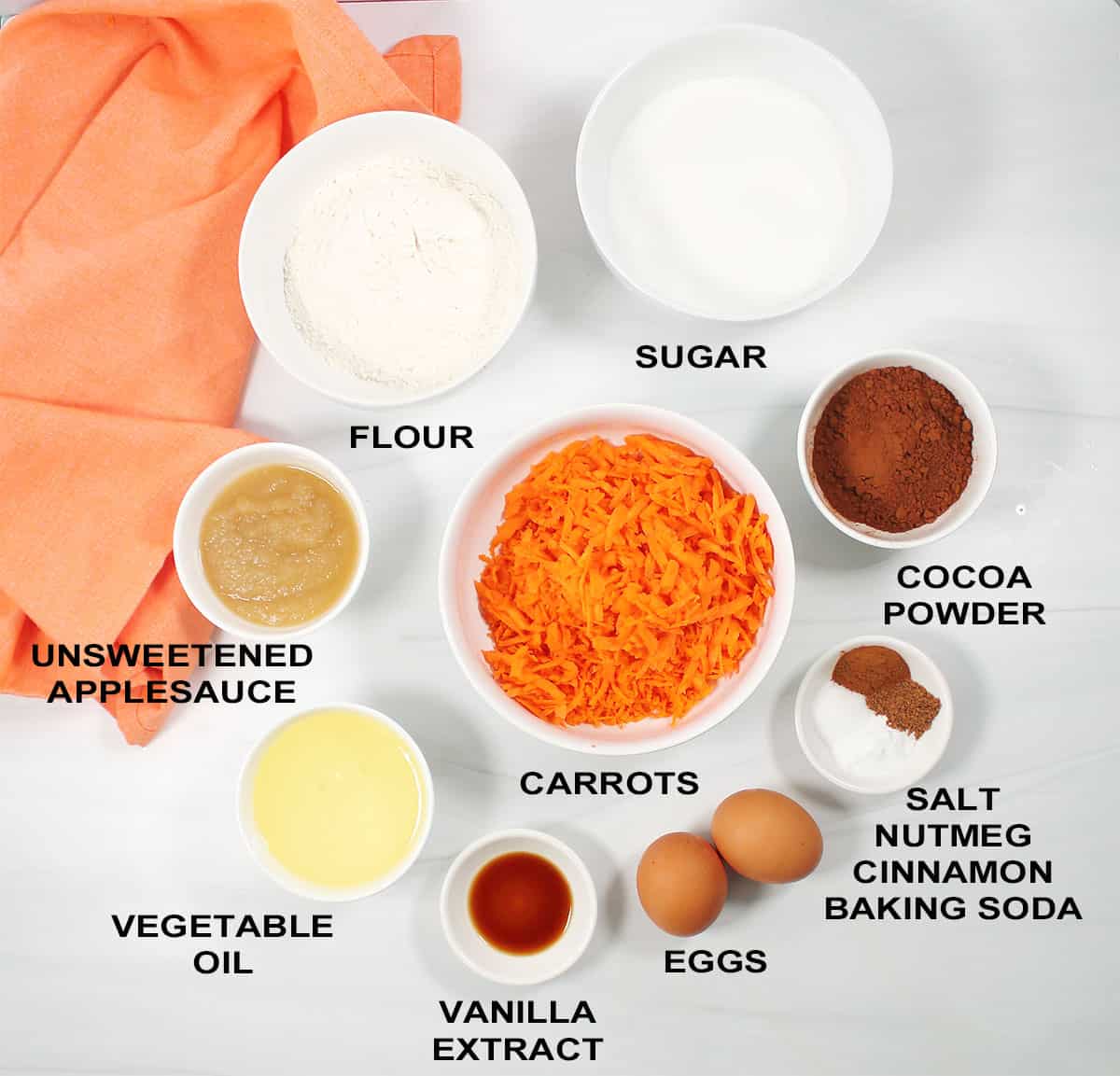 Ingredients for mini chocolate carrot cake cupcakes.