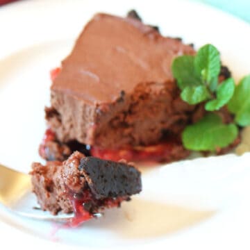 Plated slice of pie with bite on fork.
