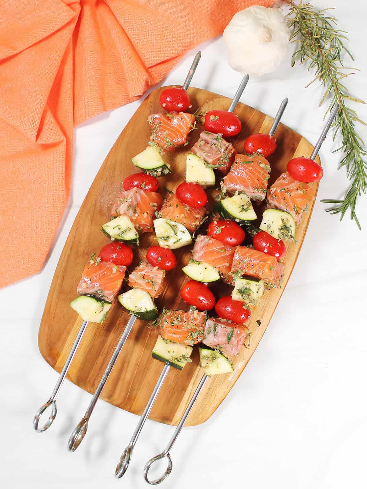 Ingredients for kabobs threaded on skewers.