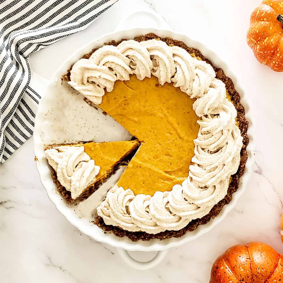 Overhead of pie with cinnamon whipped cream.