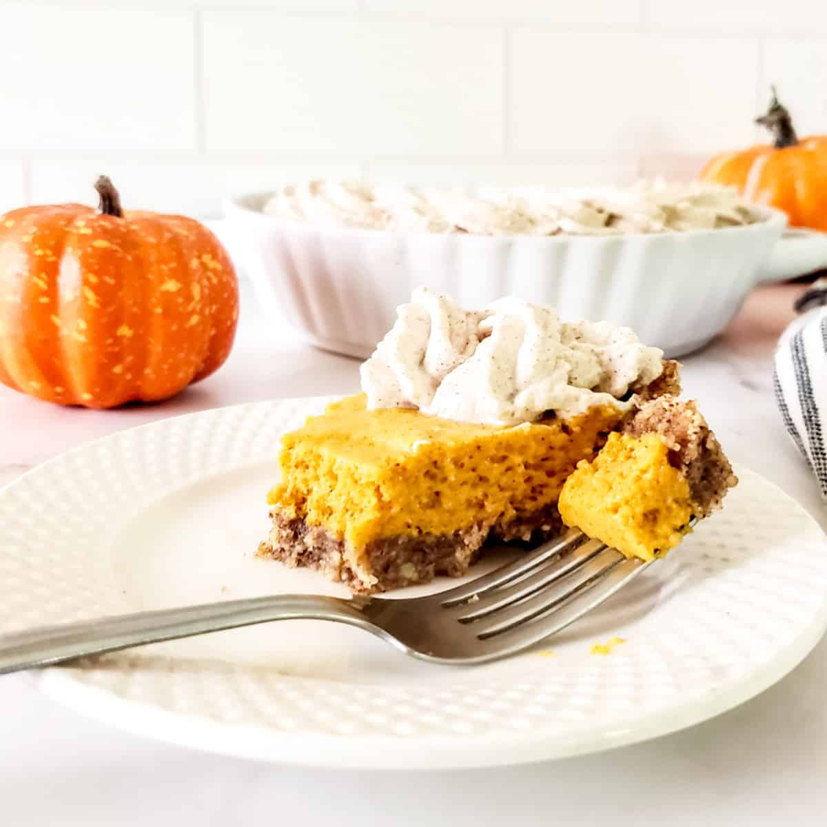 Slice of chiffon pie with bite on fork.