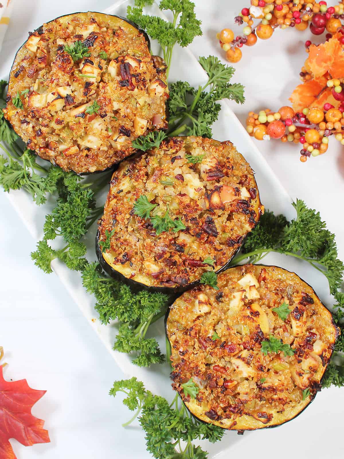 Serving platter of roasted stuffed acorn squash.