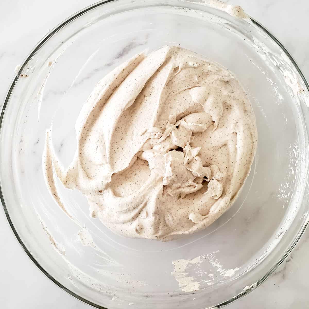 Finished cinnamon whipped cream in bowl.