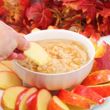 Dipping apple in dip.