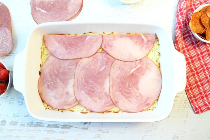 Ham slices placed on top of hash browns.