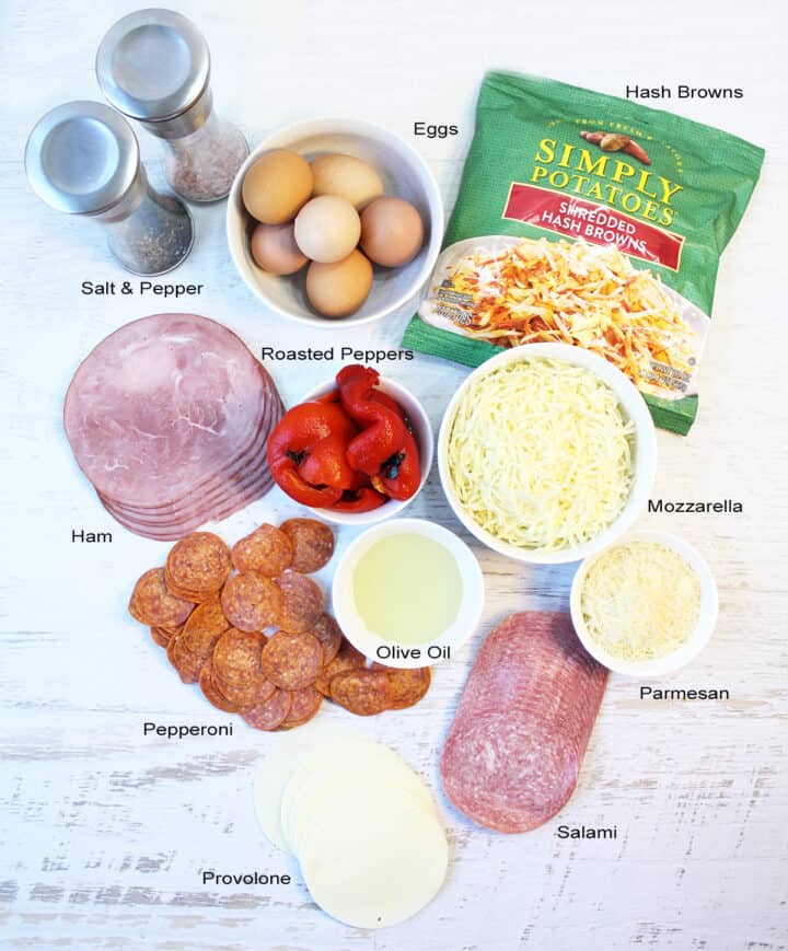 Ingredients for Italian Egg Bake laid out on white table and labeled.