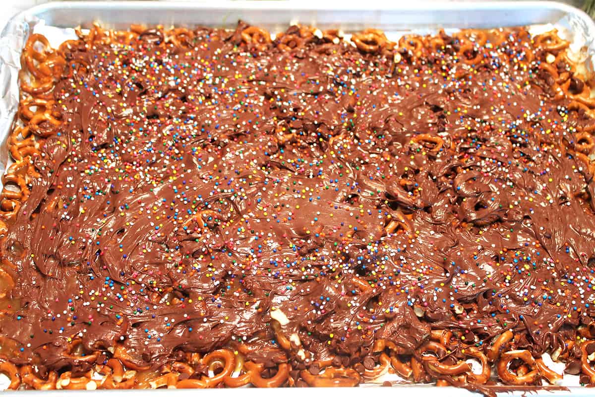 Overhead of Christmas crack with pretzels and sprinkles.