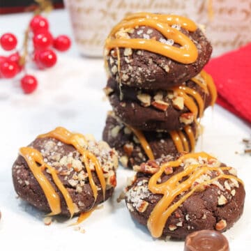 Stacked cookies on white table with Rolo.
