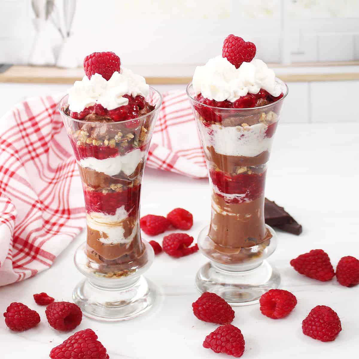 Two garnished chocolate raspberry tirfles for two.