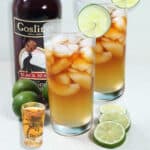 Dark and Stormy cocktails with lime slice and dark rum.