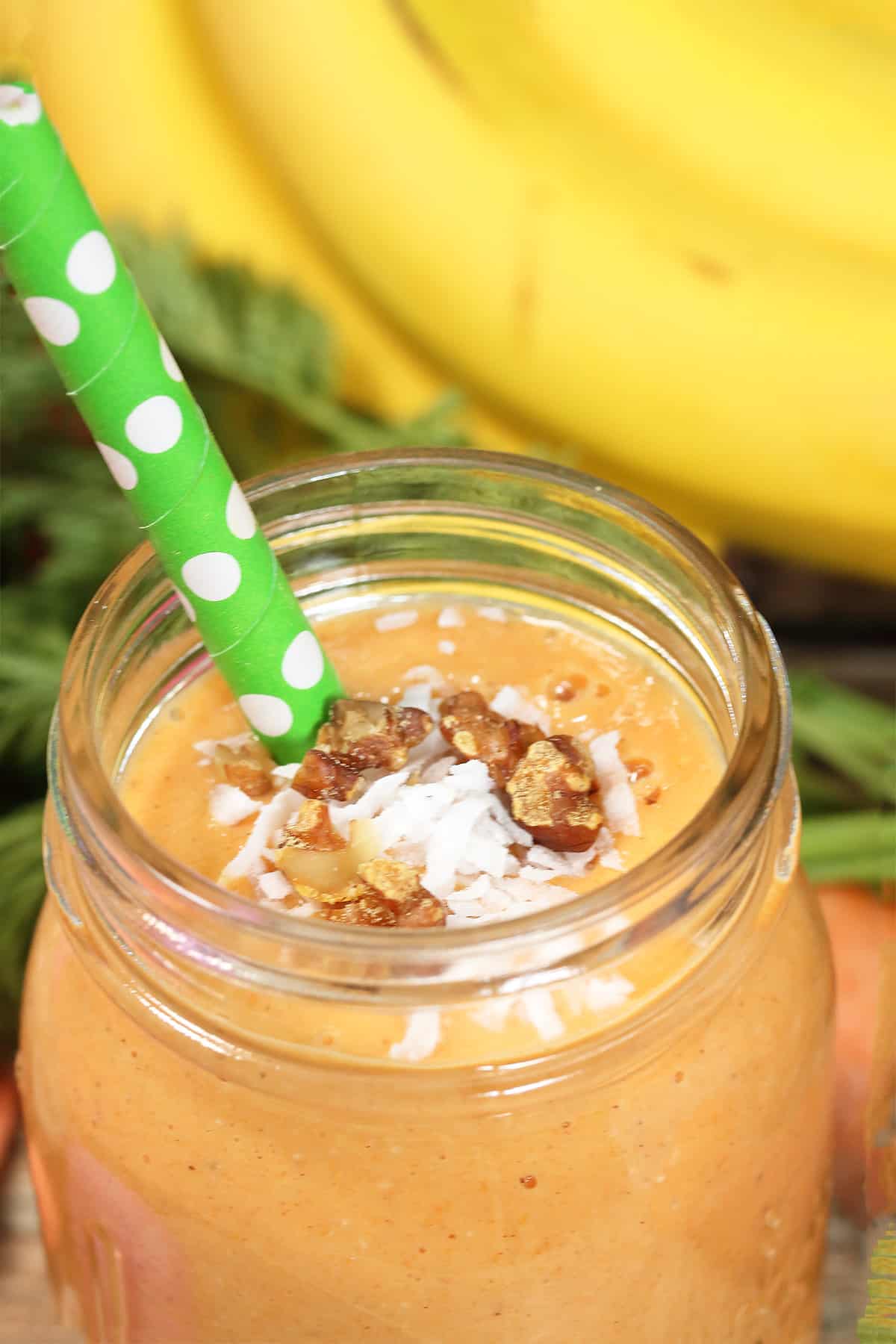 Closeup of carrot banana smoothie.