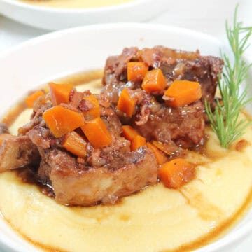 Plated Dutch oven braised short ribs dinner.