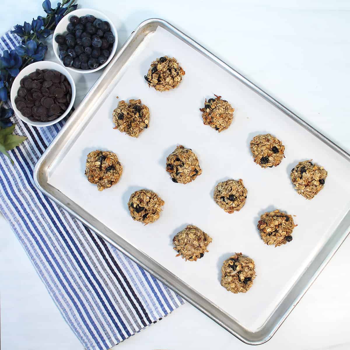 Overhead of baked cookies on cookie sheet.