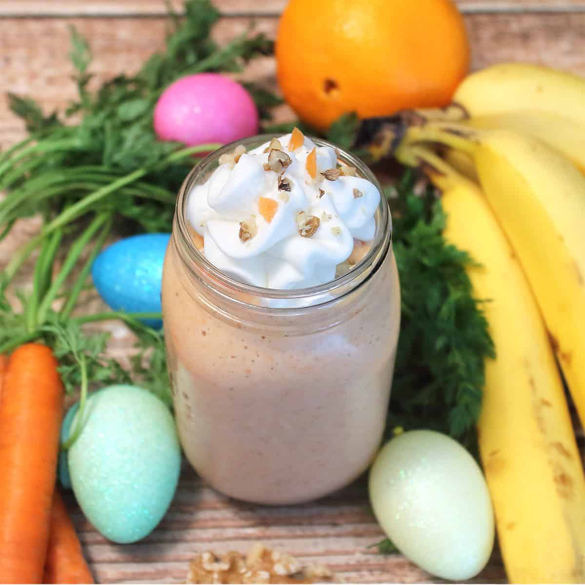 Whipped cream topped carrot smoothie.