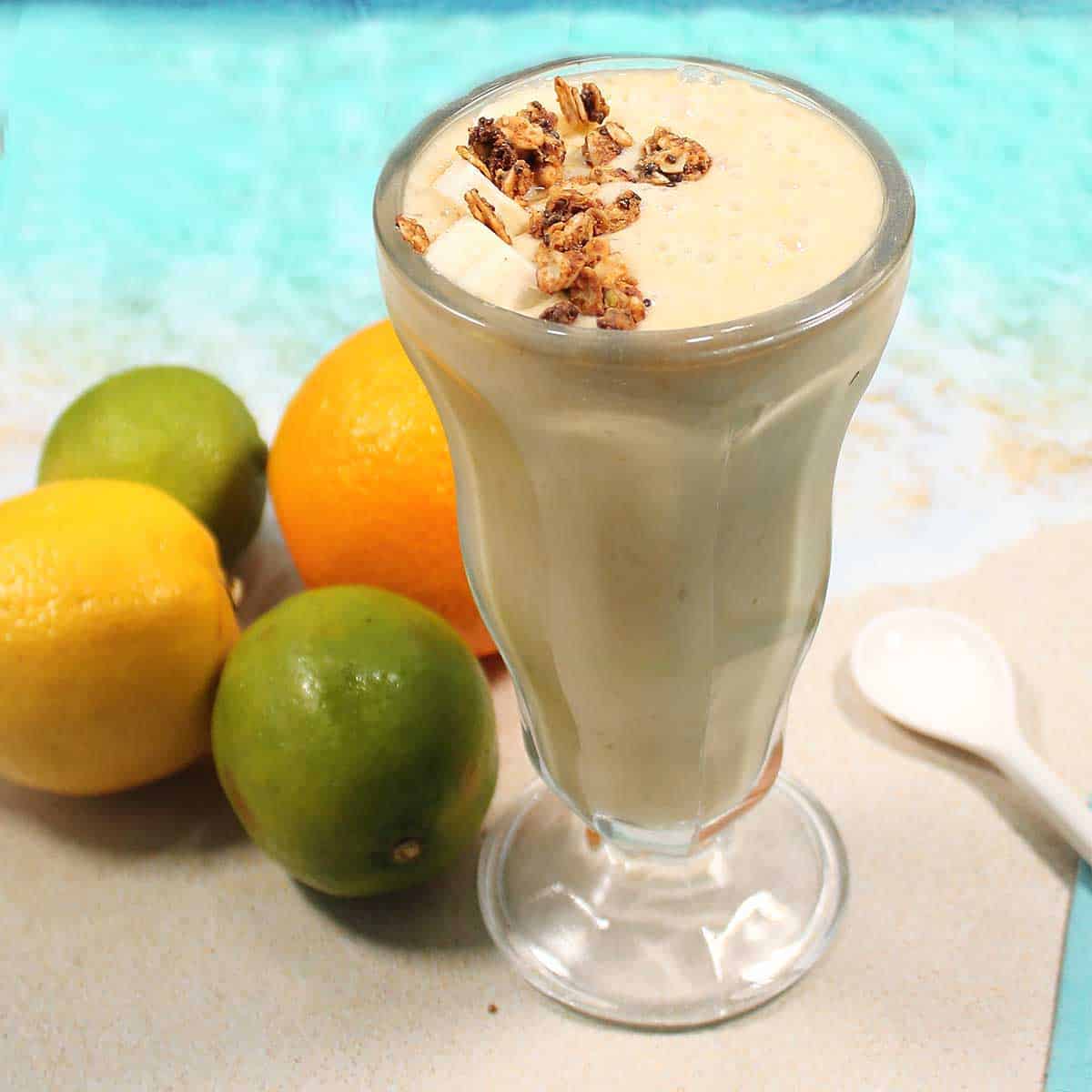 Closeup of citrus smoothie with fruit.
