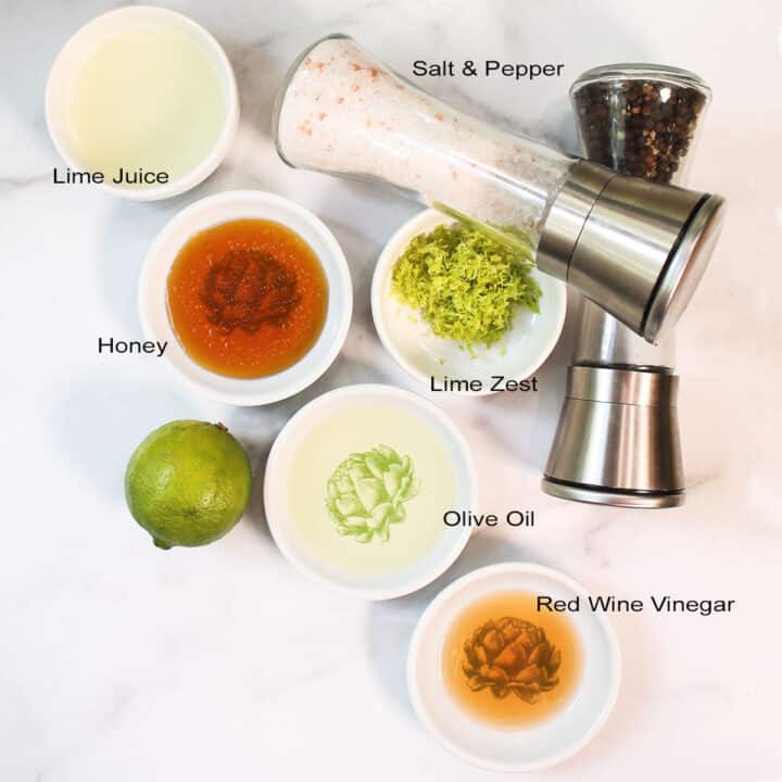 Dressing ingredients labeled on white table.