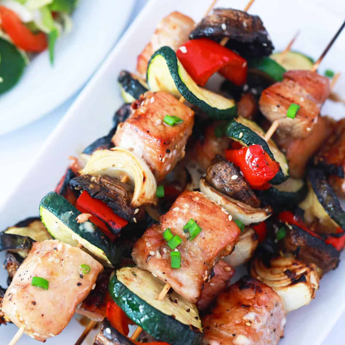 Overhead of Korean BBQ skewers on platter.