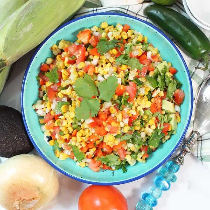 Overhead of roasted corn and avocado salad.