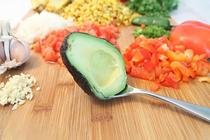 Taking avocado out of skin.