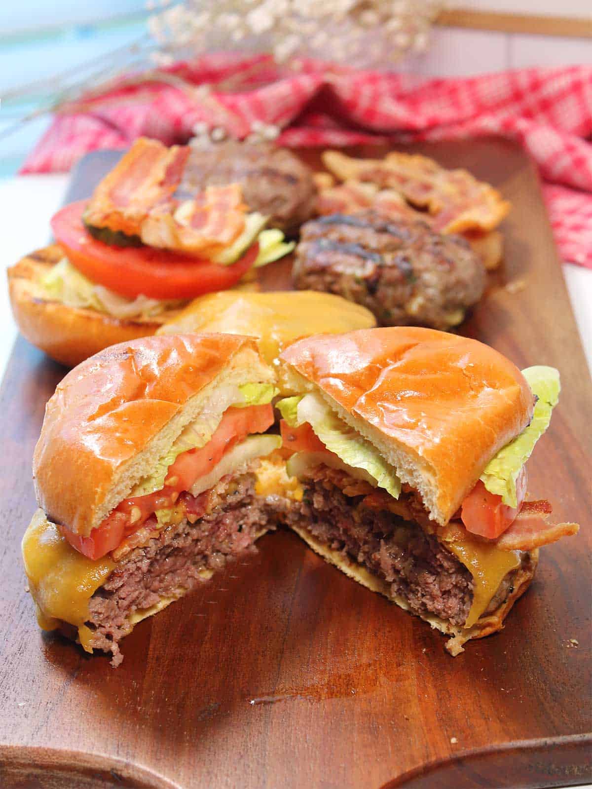 Bison burger cut in half to show doneness.