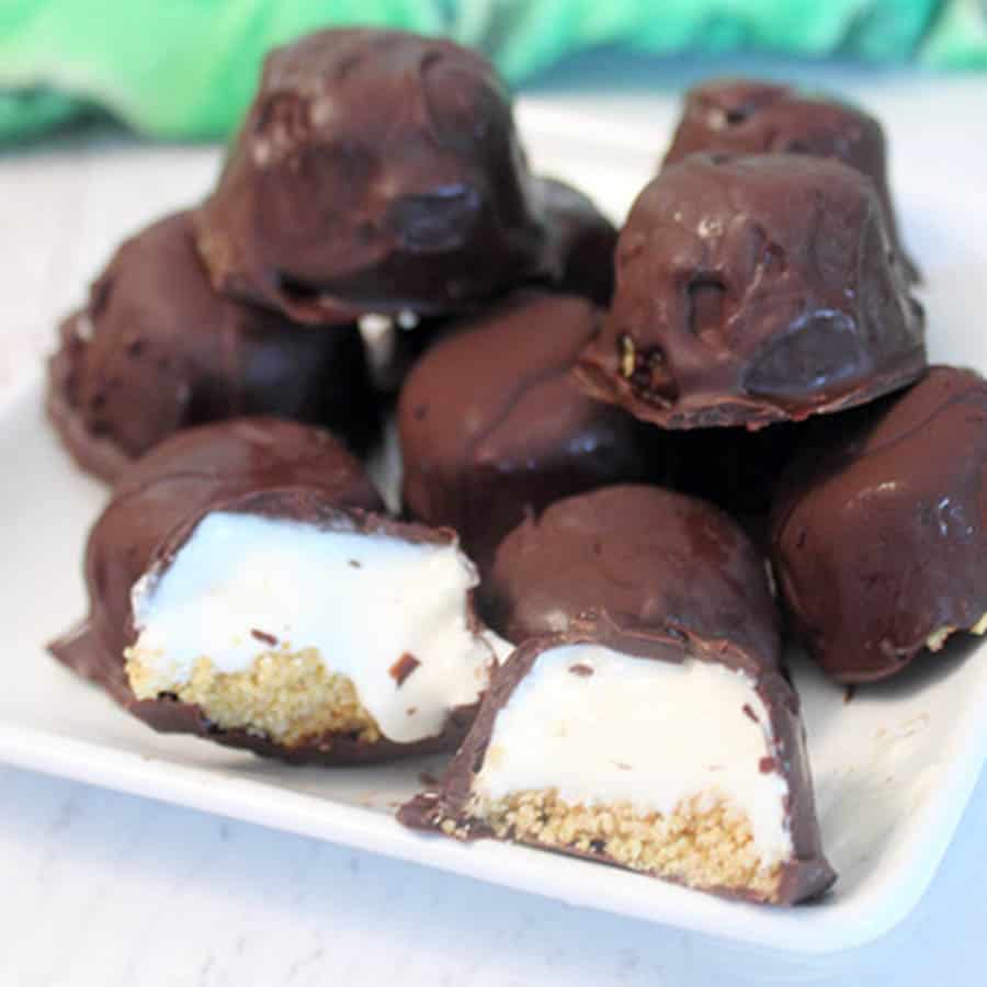 Lime bites on a white plate showing key lime filling and graham cracker layers.