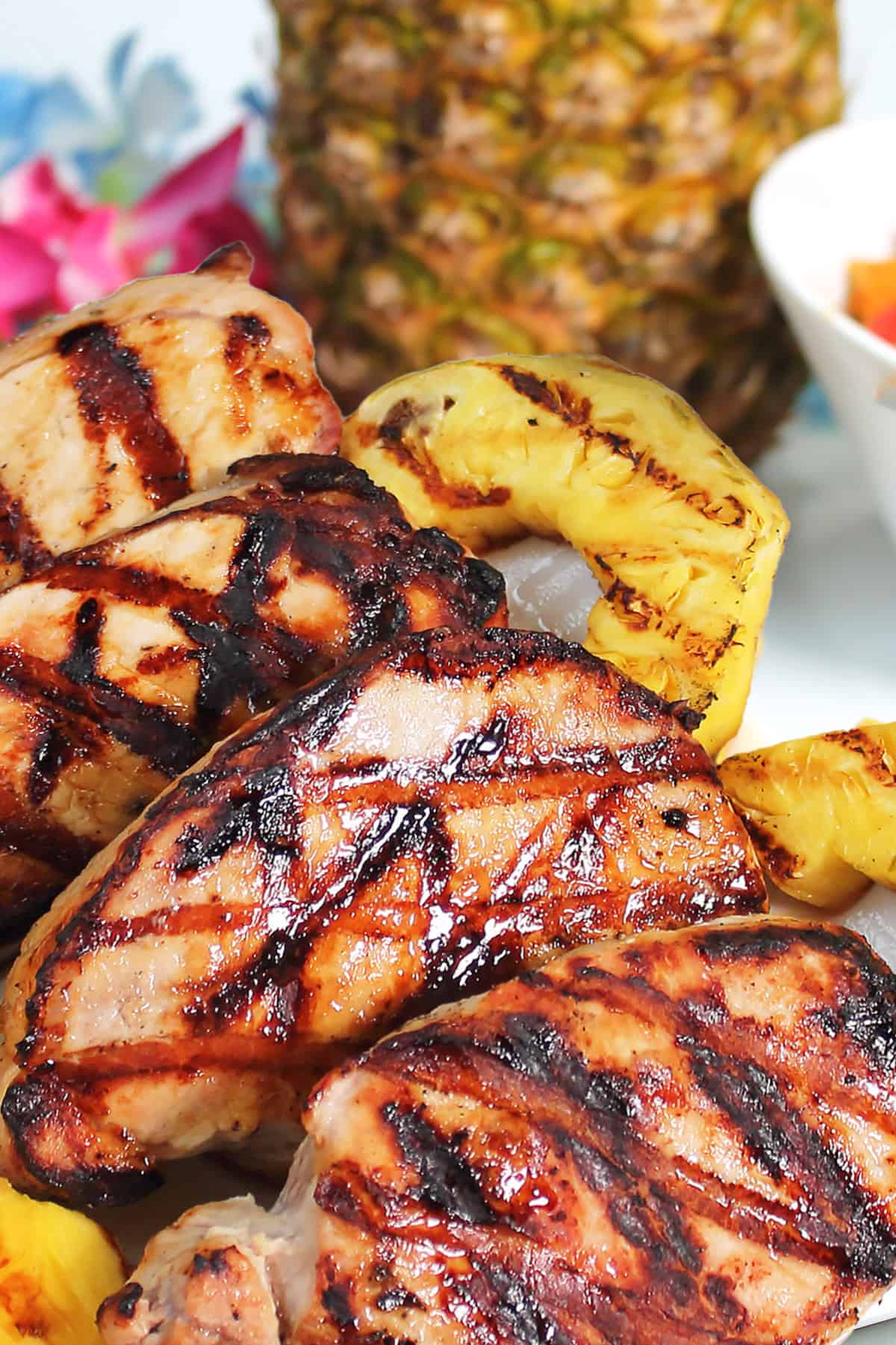 Grilled Pineapple Pork Chops on platter with pineapple rings.