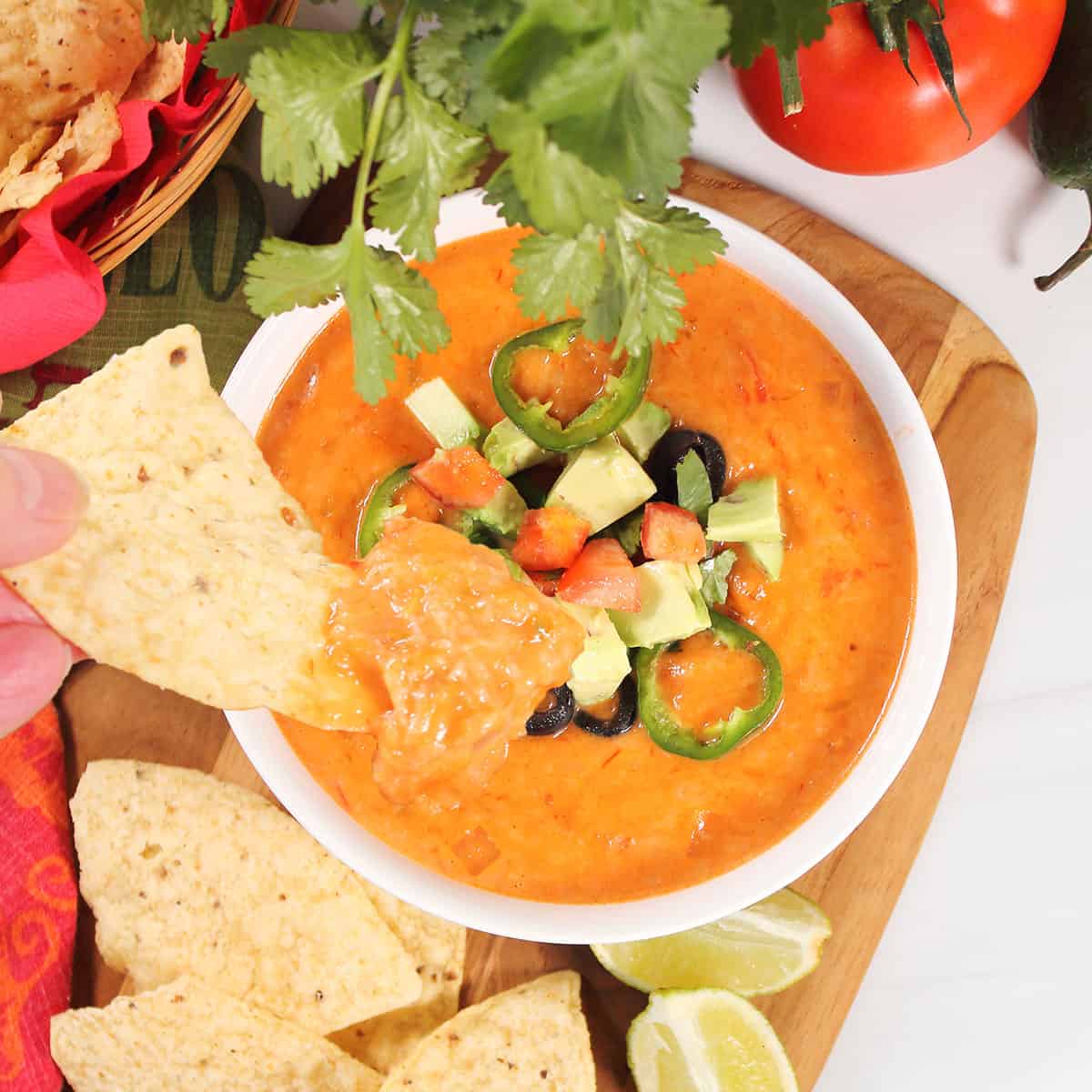 Dipping into Spicy Queso Cheese Dip.