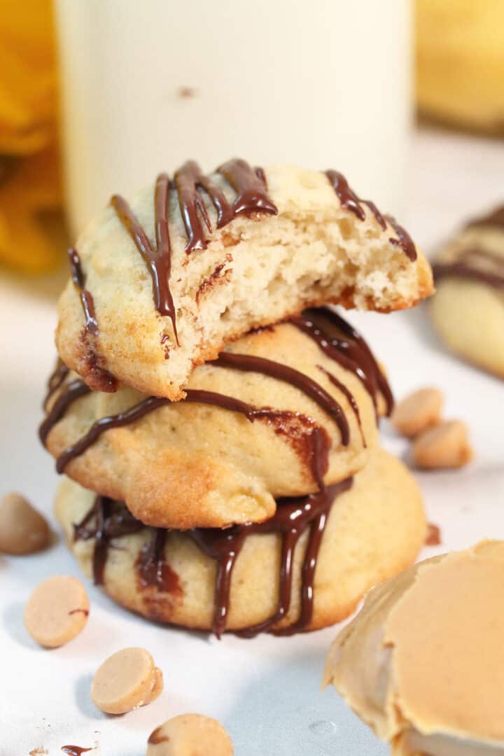 Closeup of stack cookies with bite taken out of one.