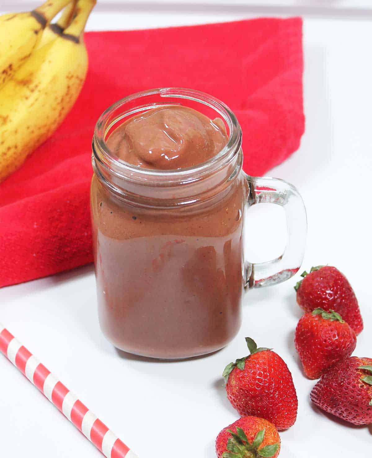 Chocolate berry smoothie in mason jar without toppings.