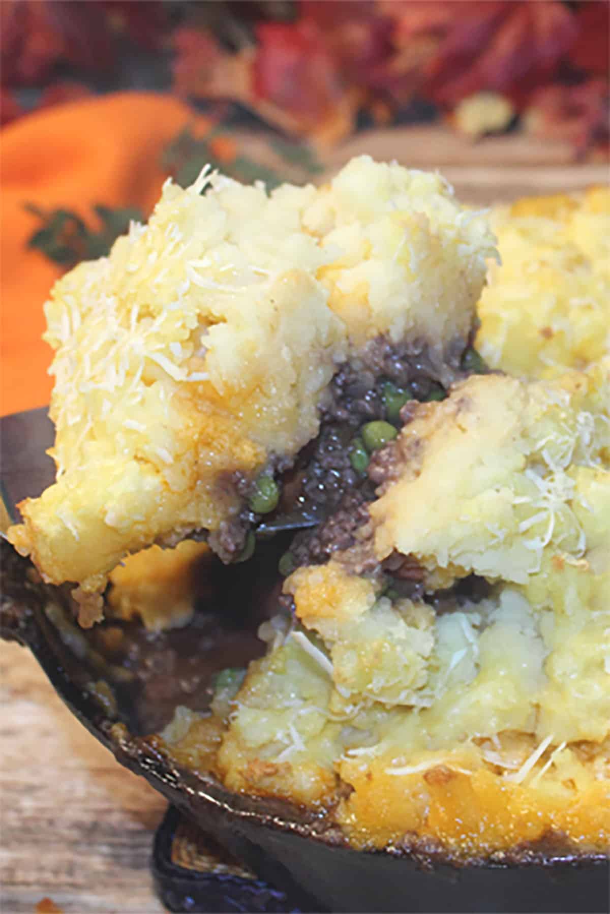 Lifting out a serving of Shepherds Pie.