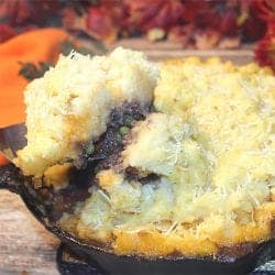 Lifting serving out of cast iron skillet.