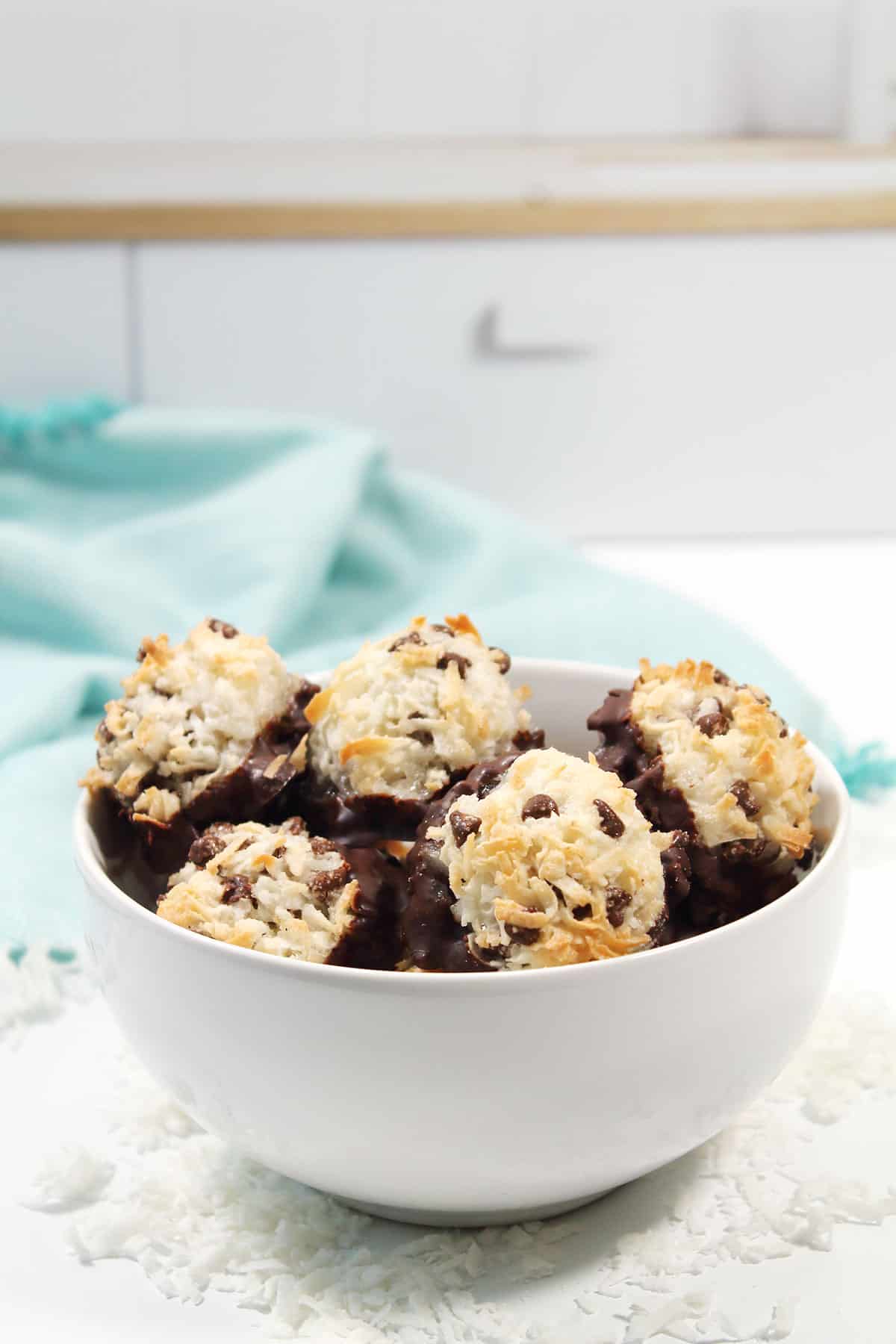 Macaroons in bowl by window.