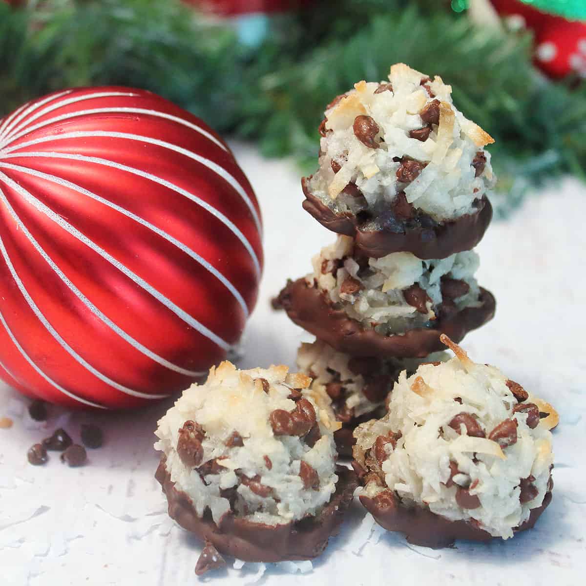 Coconut macaroons next to Christmas ornament.