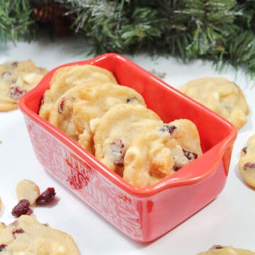 Cranberry nut cookies in Christmas dish.