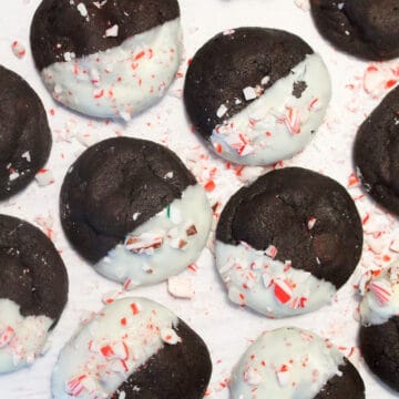 Overhead of white chocolate dipped chocolate mint cookies.