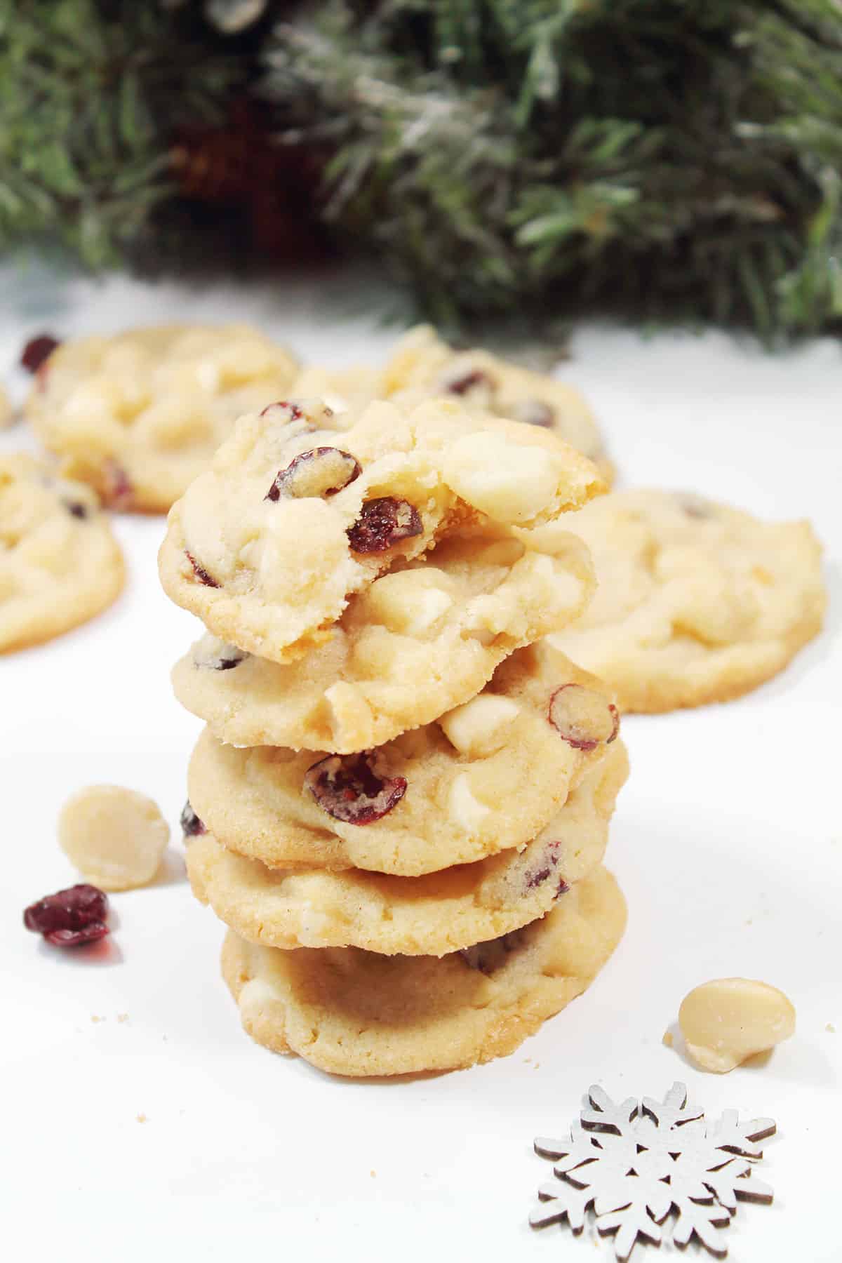 Stack of cookies with bite out of one.