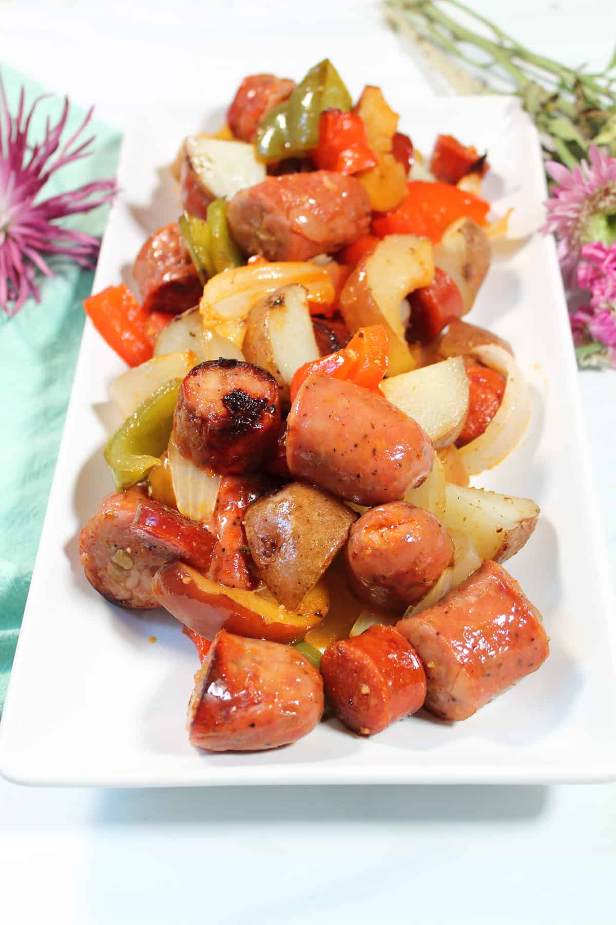 Chicken Apple Sausage dinner on white platter.
