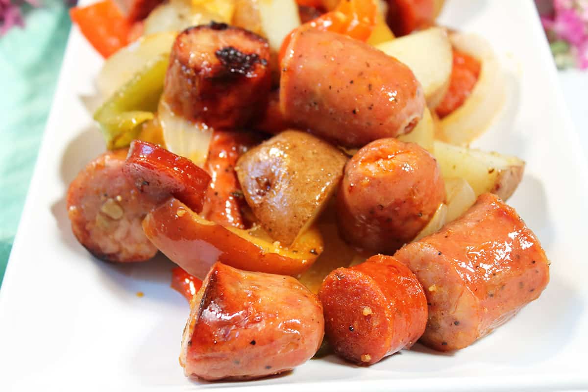 Plated chicken sausage sheet pan dinner.