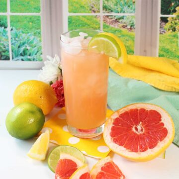 Grapefruit cocktail among grapefruit, lemons and limes.