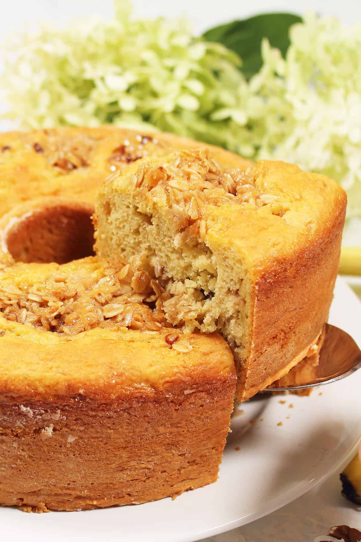 Lifting slice from banana budnt cake.