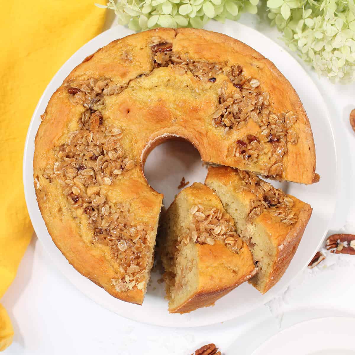 Overhead Banana Oatmeal Cake with leaning slices.