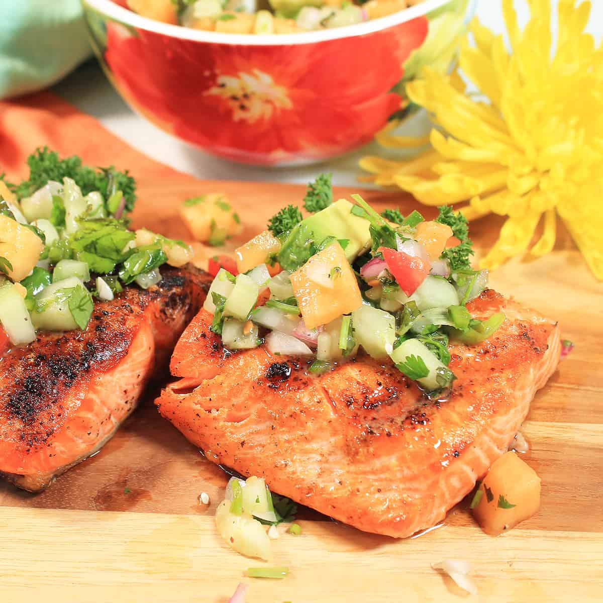 Two fillets with cucumber salsa on top.