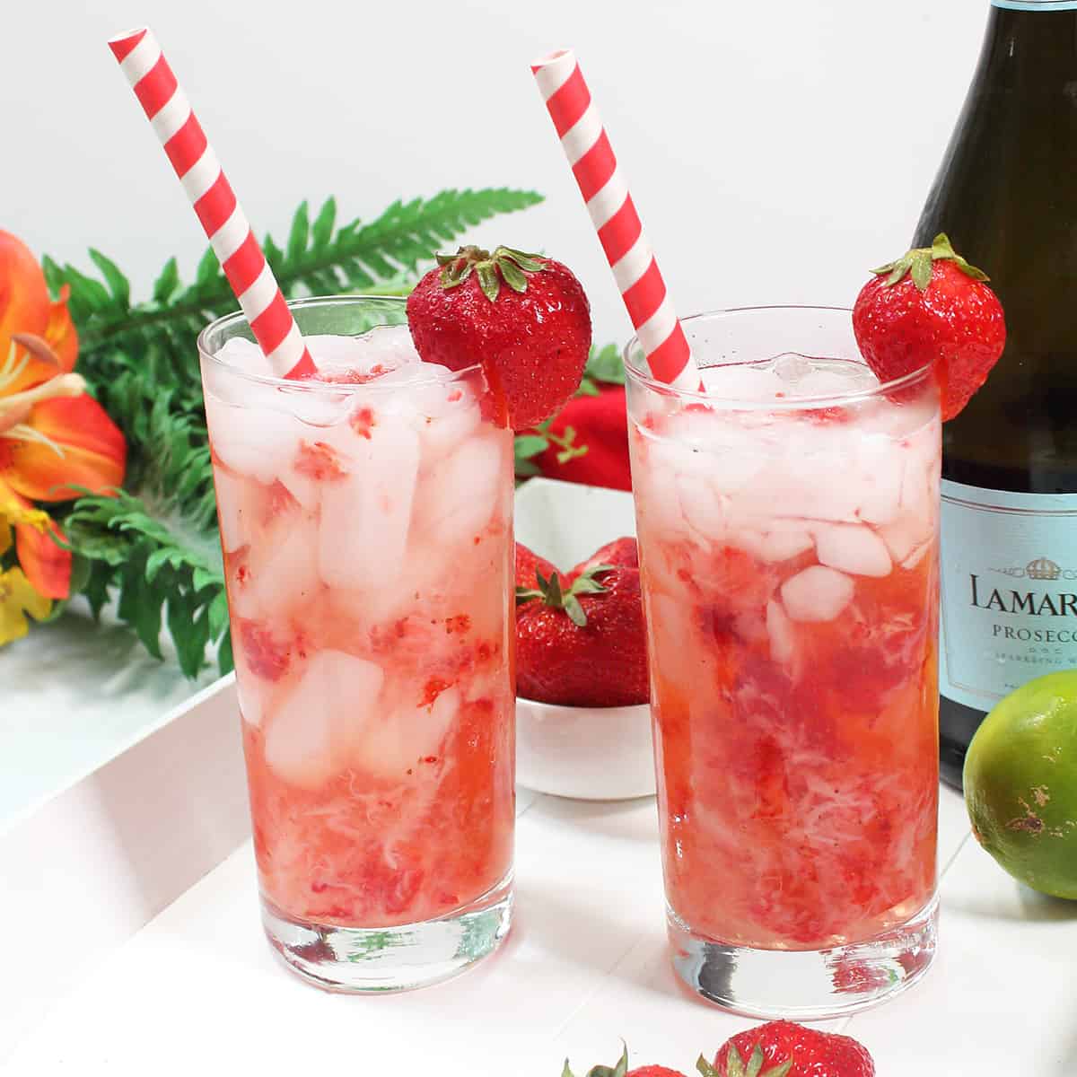 Two Strawberry Rum Cocktails on white tray.