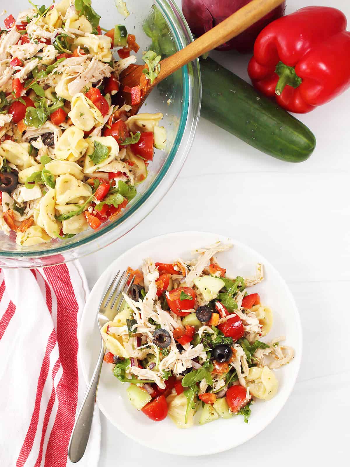 Chicken Tortellini Salad plated with partial view of bowl.