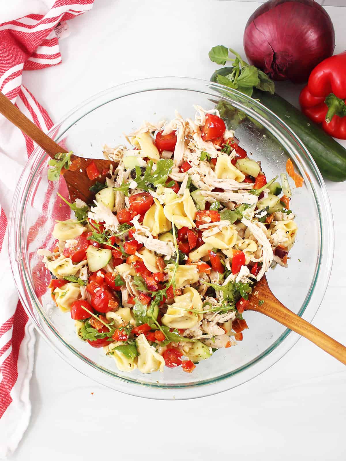 Large bowl of tossed salad with fork and spoon servers.