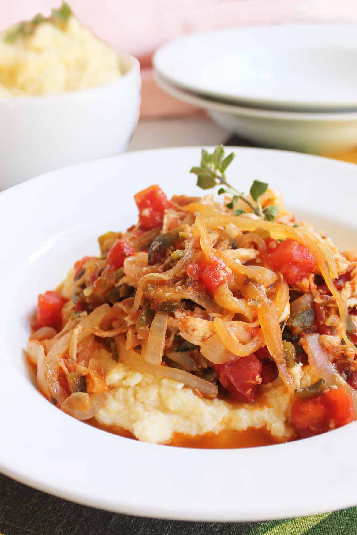 Bowlful of green chile and chicken stew over polenta.