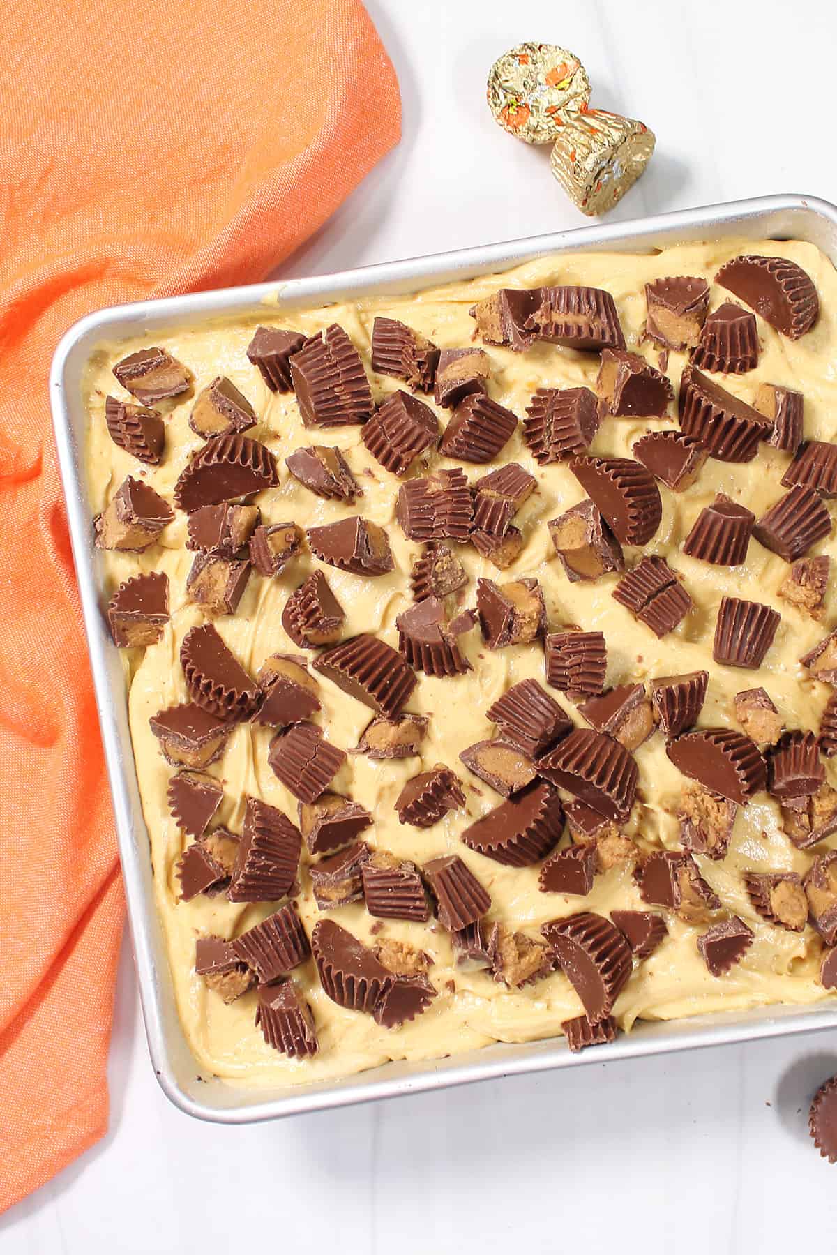Peanut Butter Cup garnish on poke cake.