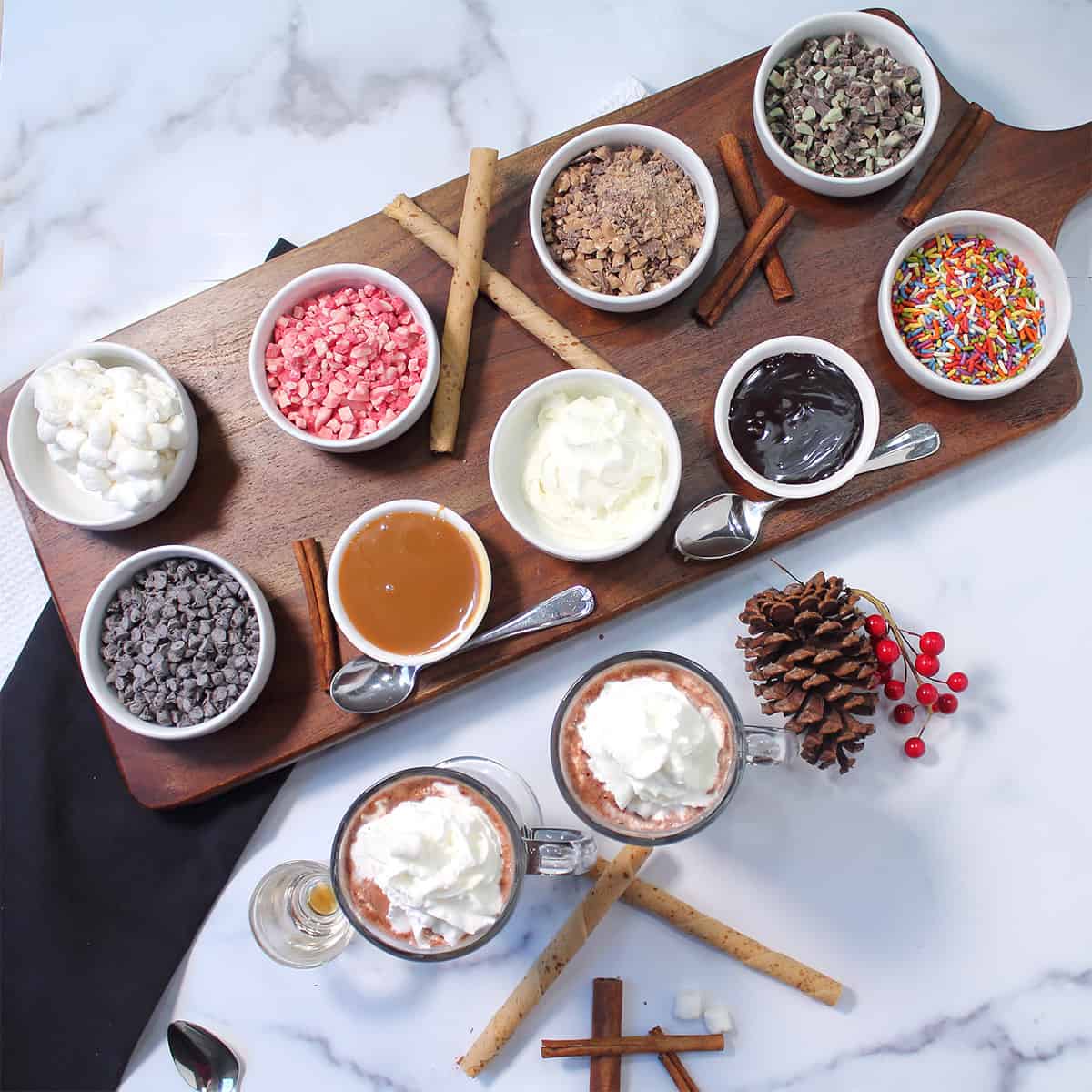 Hot Chocolate Bar with two mugs of hot chocolate in front.